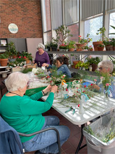a group of people doing crafts